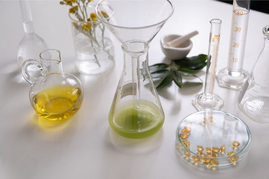 Botanical ferments skincare ingredients with natural oils and plant extracts in glass laboratory setting